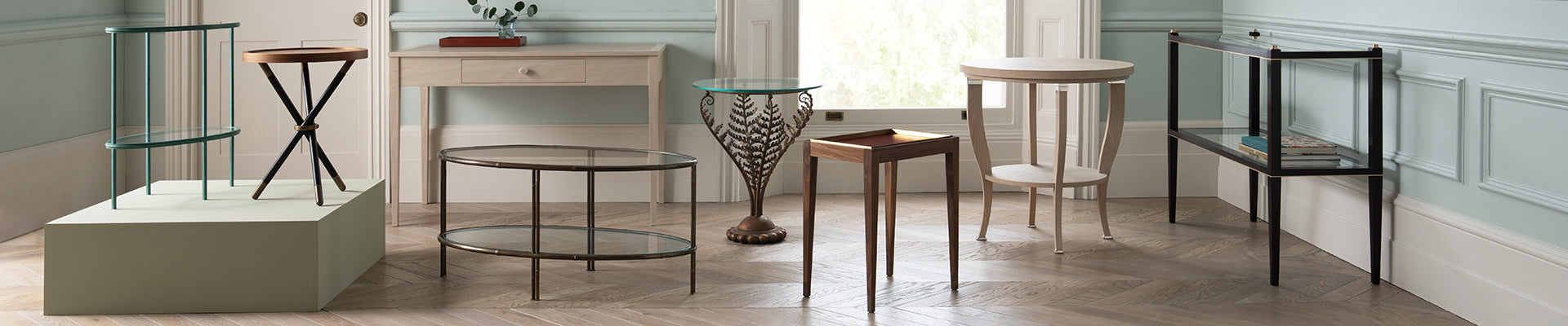 Collection of different tables and desks in a blue room