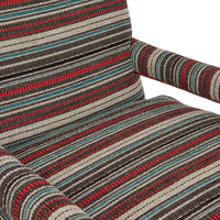Nina Campbell Mackenzie Arm chair, in striped red, grey and blue fabric, on a white background.