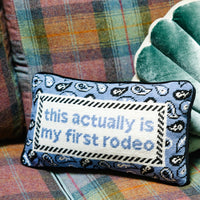 Nina Campbell Needlepoint Cushion First Rodeo against couch