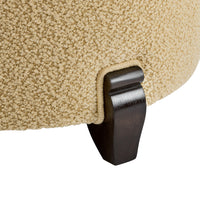 Nina Campbell Coco Occasional Chair in yellow cardot fabric against a white fabric leg close up