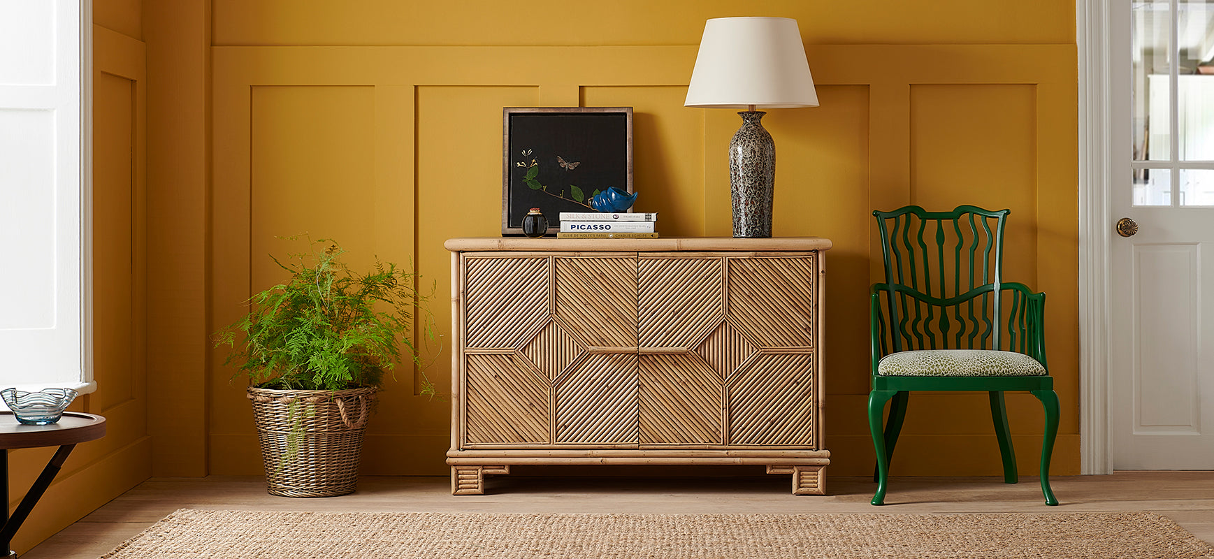 Nina Campbell Alfred Bamboo Sideboard in a yellow room set with Archie Chair