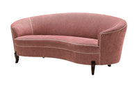 Nina Campbell Audrey Sofa in red fabric with white contrast piping against a white background angled view