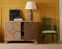 Nina Campbell Archie chair painted green in room set with Alfred Bamboo Sideboard