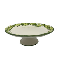 Nina Campbell ceramic lily of the valley cake stand side view against a white background