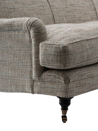 Nina Campbell Collingwood Sofa in Dallimore Weald fabric against a white background close-up shot of arm and leg