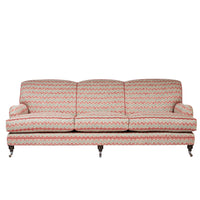 Nina Campbell Collingwood Sofa in dumas red and blue fabric against a white background