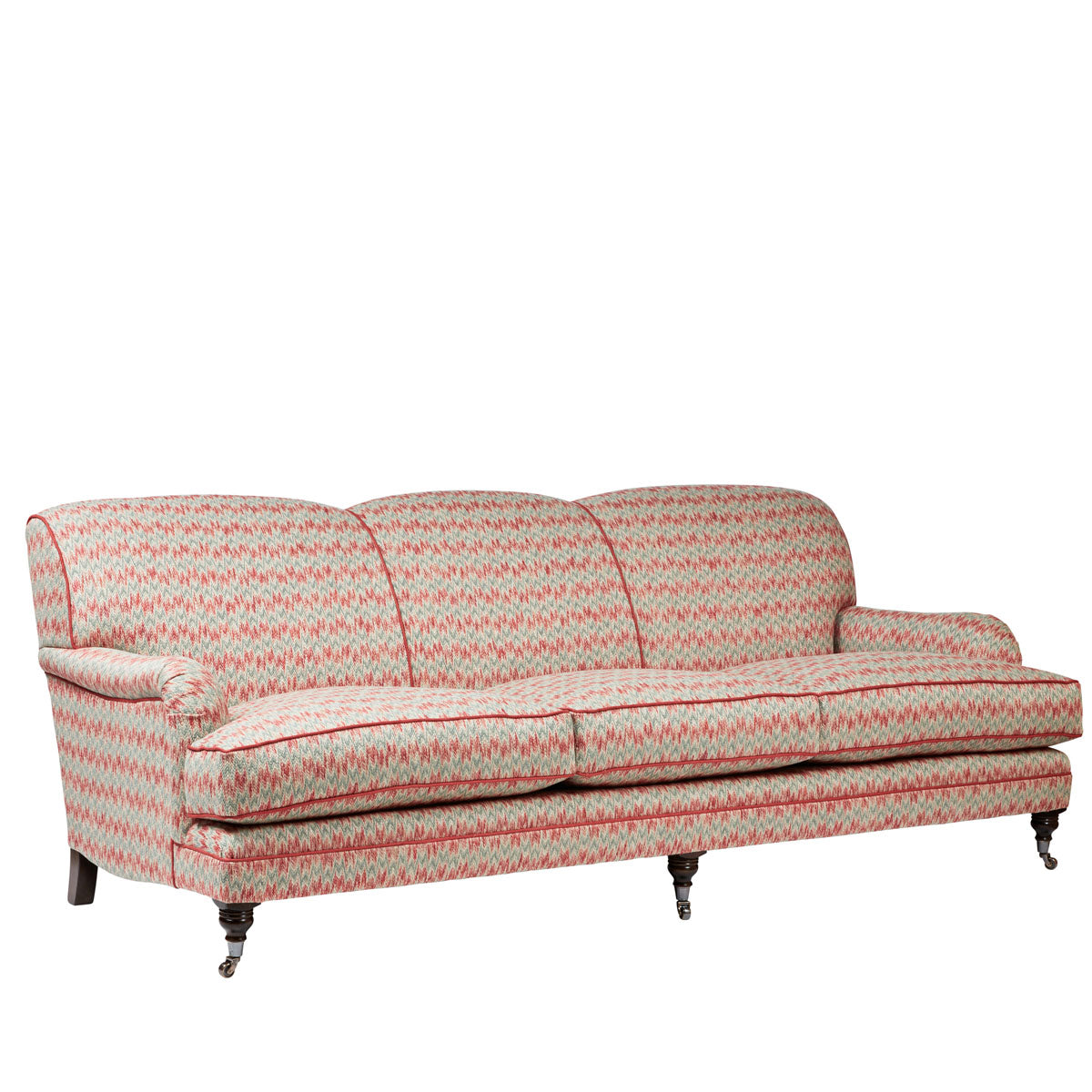 Nina Campbell Collingwood Sofa in dumas red and blue fabric against a white background angled shot