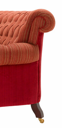 Nina Campbell Gatsby Buttoned Sofa in two red fabrics fabric against a white background arm and back detail photo