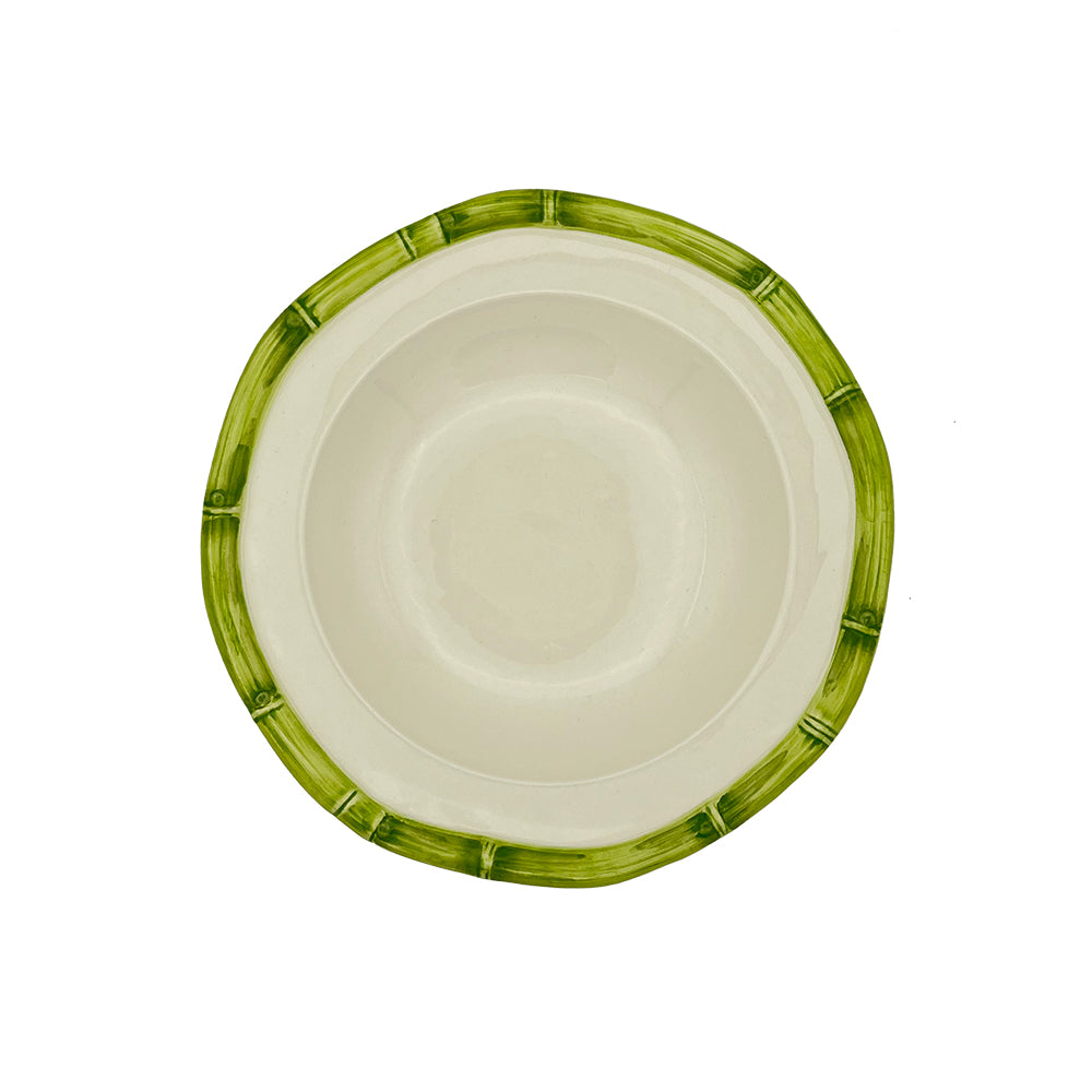 Nina Campbell ceramic pasta bowl with hand painted bamboo design on edge in green against a white background