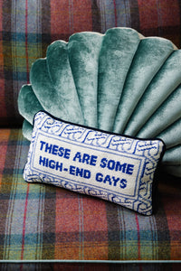 Nina Campbell Needlepoint Cushion High-End Gays against pillow and couch