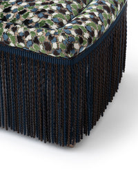 Nina Campbell Isabella Chair in orford fabric and fringes against a white background fringe close up