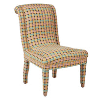 Nina Campbell Isabella Chair in Fontainebleu yellow and pink fabric against a white background angled shot