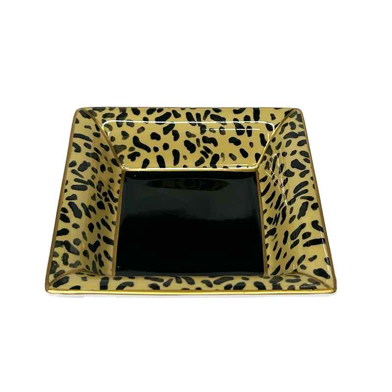 Nina Campbell ceramic square tray with leopard print against a white background
