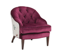 Mabel Chair in pink velvet fabric and butterfly patterned fabric against a white background angled shot