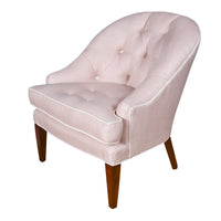 Mabel Chair in light pink fabric against a white background angled shot