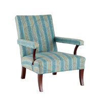 Nina Campbell Mackenzie Arm chair, in a striped blue and yellow fabric, on a white background.