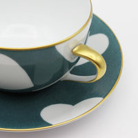 Nina Campbell Heart Breakfast cup and saucer handle detail in Bleu Ardoise colour on white background.