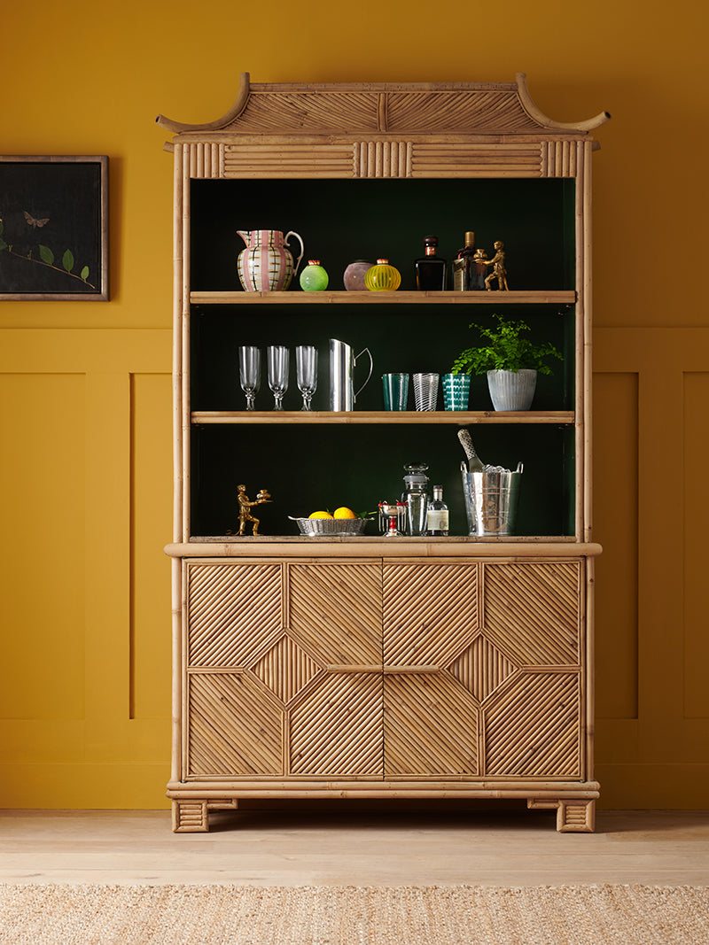 Nina Campbell Alfred Bamboo bookcase in a yellow room set