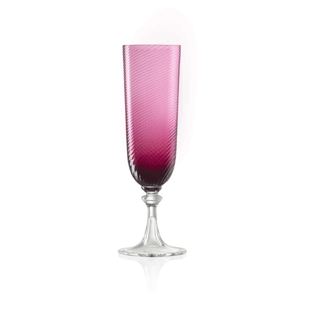Nina Campbell ruby colored champagne class against a white background