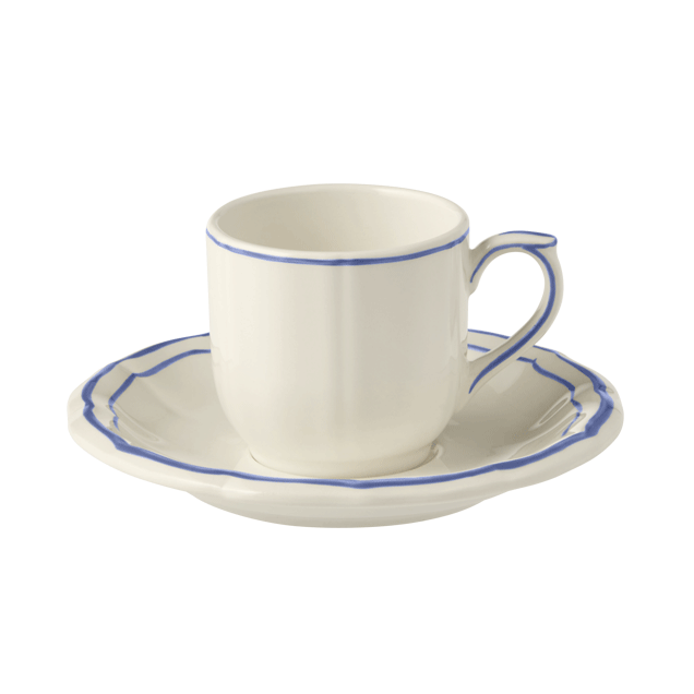 A white ceramic tea cup with blue accents on the rim and handle, accompanied by a matching saucer with a blue border.