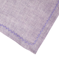 Nina Campbell Feather Stitch Napkin Amethyst against a white background close up