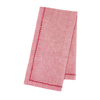 Nina Campbell Feather Stitch Napkin Pink Sapphire against a white background