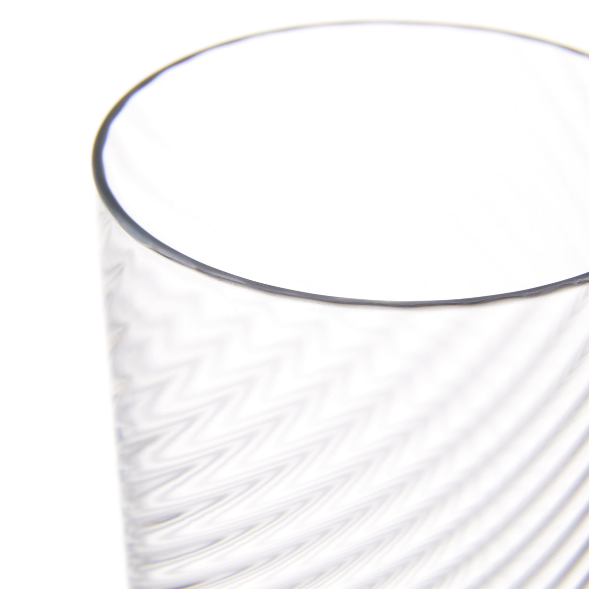 Nina Campbell Champagne glass against a white background close up