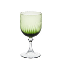 Nina Campbell Green red wine glass against a white background