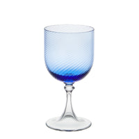 Nina Campbell red wine glass in blue against a white background