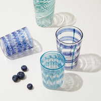 Nina Campbell Small Tumbler Aqua/White with other blue glassware