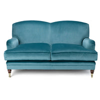 Nina Campbell Collingwood Sofa in a blue velvet fabric against a white background
