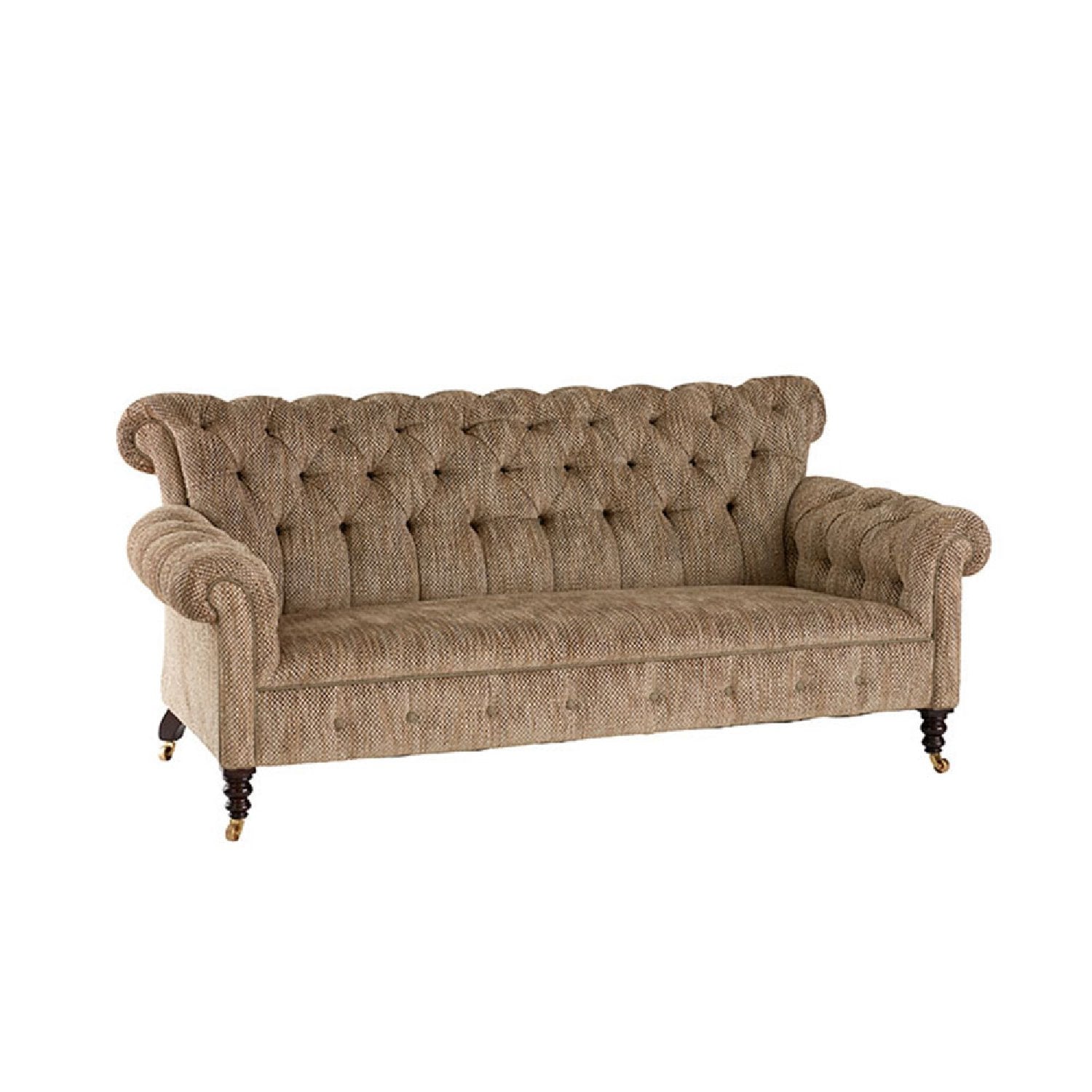 Nina Campbell Gatsby Buttoned Sofa in brown fabric against a white background in angled shot