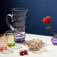 Nina Campbell Swirl Bonbon Bowl Amber on table setting with other swirl glassware