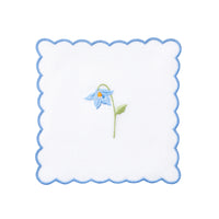 Nina Campbell cocktail napkin / coaster blue flower on white background
