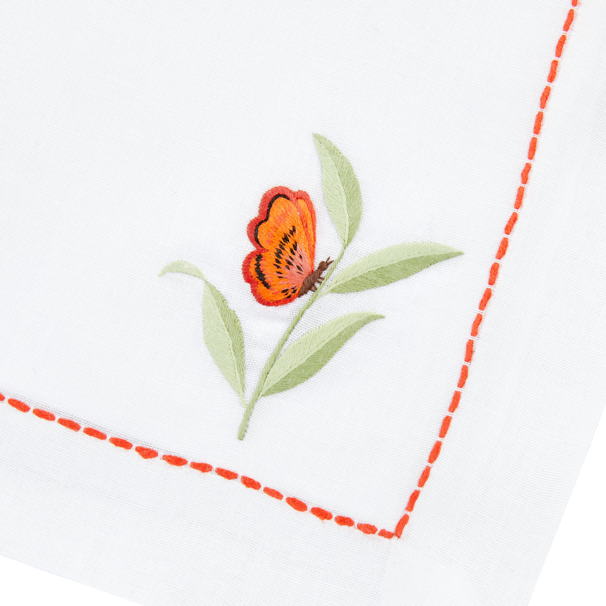 Nina Campbell Coral Butterfly Napkin against a white background close up