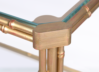 Nina Campbell Pagoda End Table in Gold Gilt against a white background close up of table corner