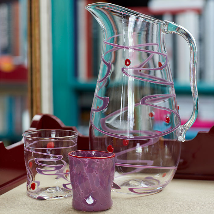 Nina Campbell Wackie Pitcher Purple/Red with other purple/red glassware