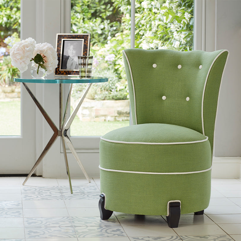 Nina Campbell Coco Occasional Chair in green colette fabric in room set with arthur side table