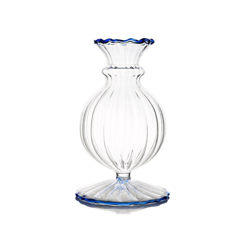 Nina Campbell  clear small glass vase with blue rims against a white background