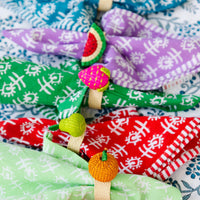 Nina Campbell Raffia Napkin Ring Watermelon and other napkin rings on colourful napkins