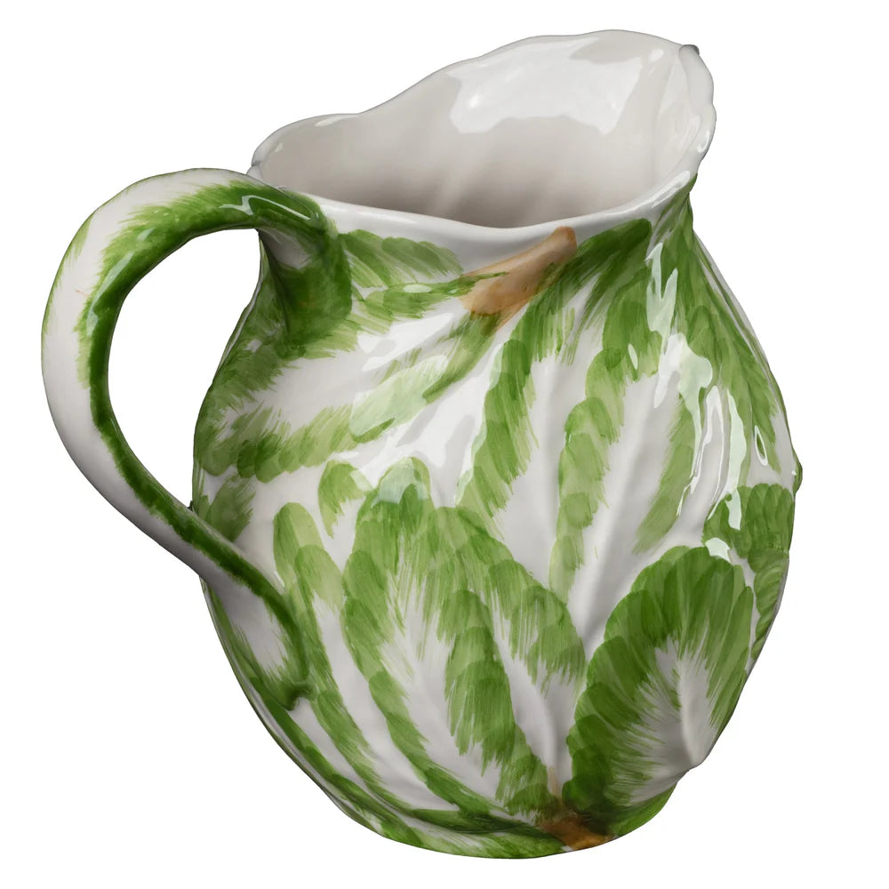 Nina Campbell ceramic jug with green leaf patterns against a white background