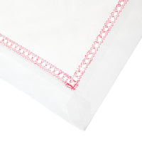 Nina Campbell Hemstitch Placemat pink corner shot against a white background