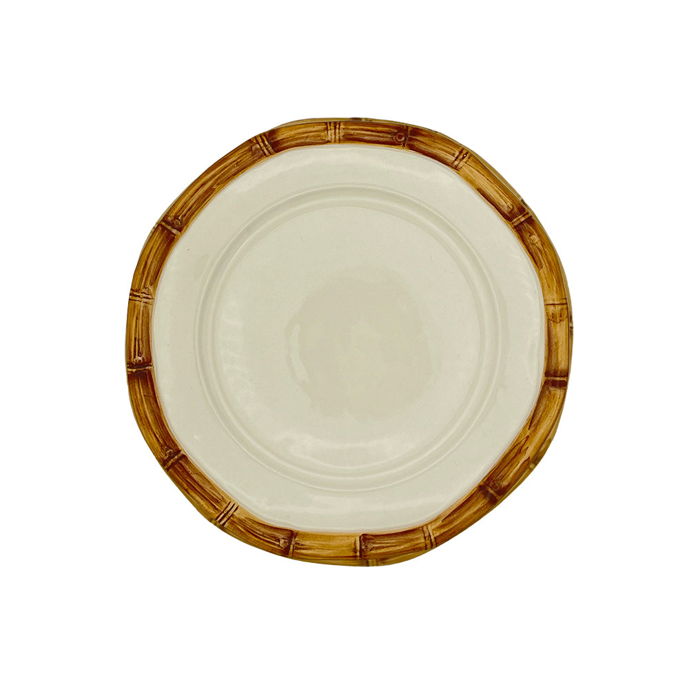 Nina Campbell white ceramic plate with painted natural bamboo design on edge against white background