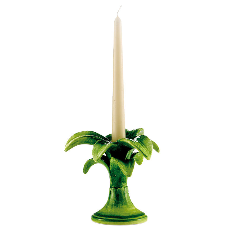 Nina Campbell ceramic small palm candlestick holder painted in green with an ivory candle against a white background