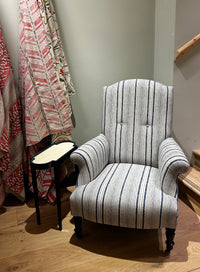 Nina Campbell Manfred Wing chair, in a blue stripy fabric, photographed in the pimlico road showroom.