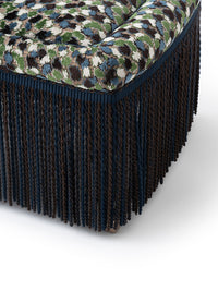 Nina Campbell Isabella Chair in orford fabric and fringes against a white background fringes close up