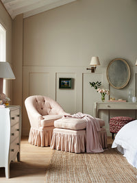 Nina Campbell pink fabric Mabel chair with frilled skirt and matching Mabel Run Up stool and margot writing table and Margot chest of drawers