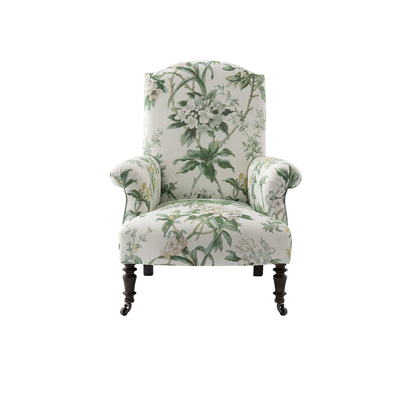 Nina Campbell Miller Chair, in a white and green floral fabric, on a white background.