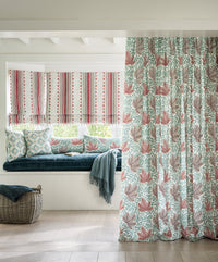 Nina Campbell Athena fabric Collection as seen on cushions, blinds, a curtain and the gabrielle velvet fabric on a window seat cushion.