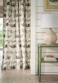 Nina Campbell Athena Peggy Fabric as seen on a curtain and a basketweave table lamp